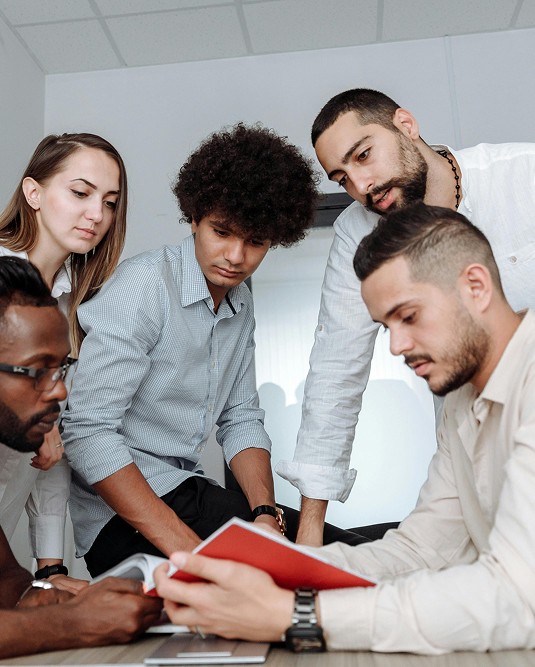 diverse team reviewing documents office